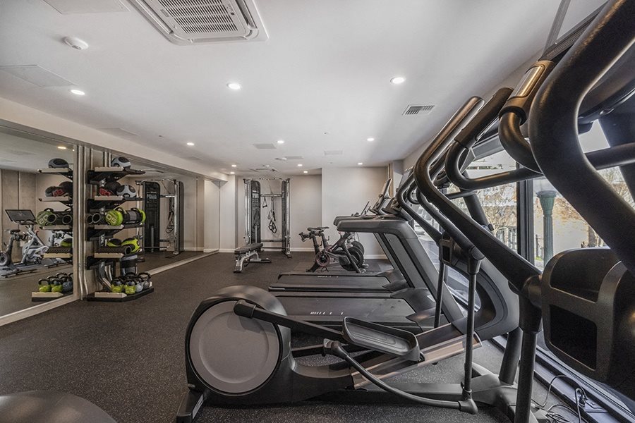 Gym with cardio equipment l Rasa Apartments in Oakland CA